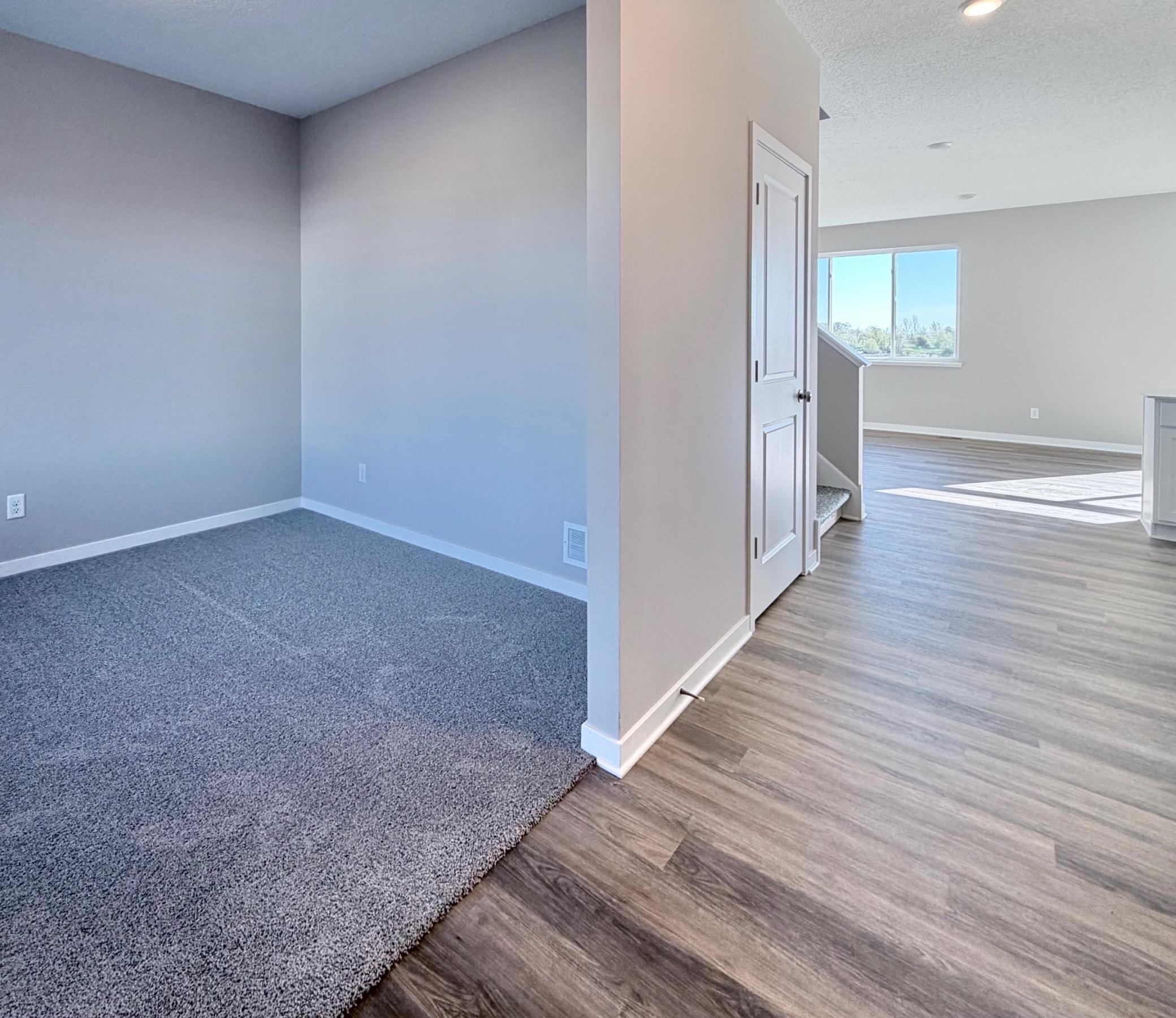 PHOTO OF A DIFFERENT HOME WITH SIMILAR PLAN. FINISHES MAY VARY. Foyer view to the Main Floor Flex Room.