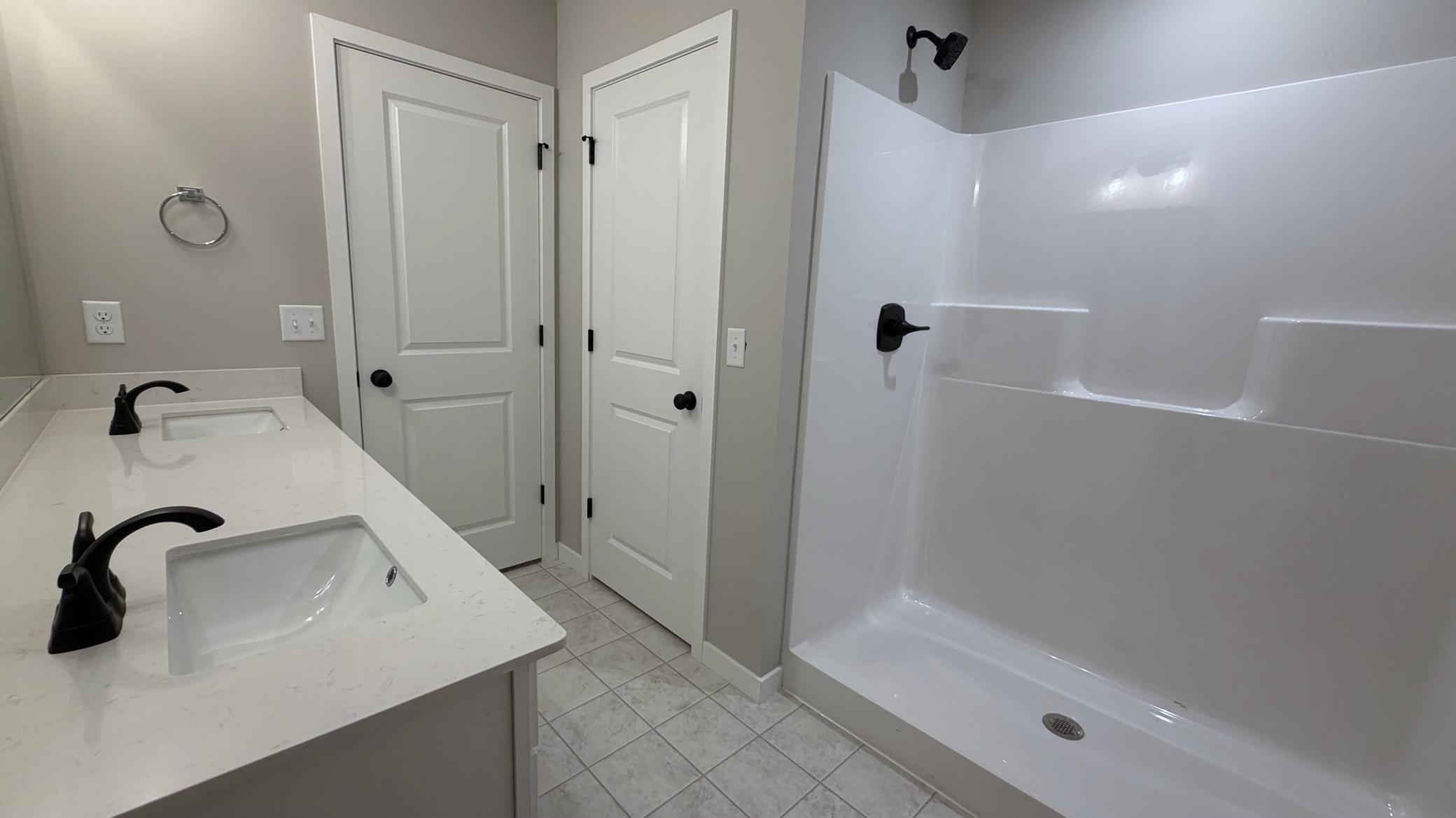 PHOTO OF A DIFFERENT HOME WITH SIMILAR PLAN. FINISHES MAY VARY. Primary Suite Private Bathroom.