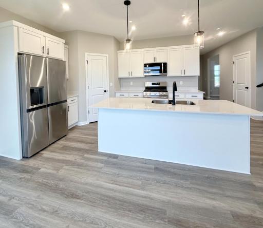 3153 Jandura Ave NE- Kitchen highlights include a Walk-in Pantry and Center Island.