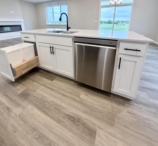 3153 Jandura Ave NE- Cabinet base features a trash and recycling pullout convenient to the sink.