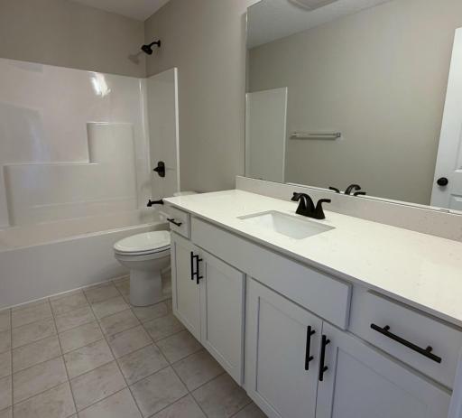 PHOTO OF A DIFFERENT HOME WITH SIMILAR PLAN. FINISHES MAY VARY. Upper Level Main Full Bathroom.