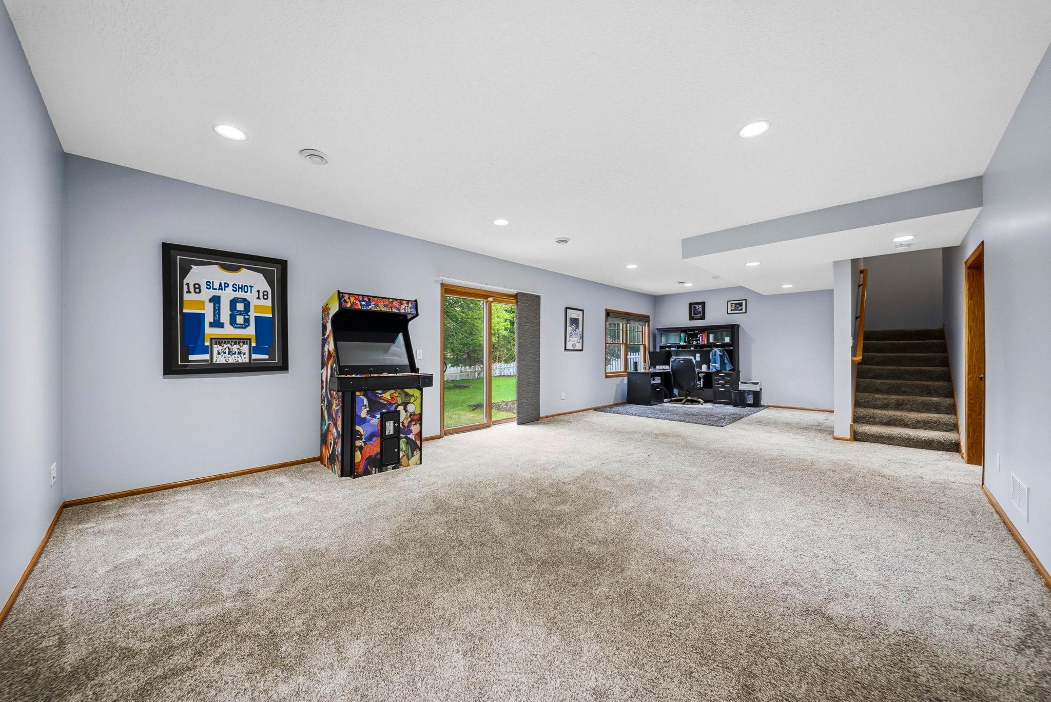 The lower level rec room is perfect for a gaming area, workout space or adding your own finishing touch, plus walkout.