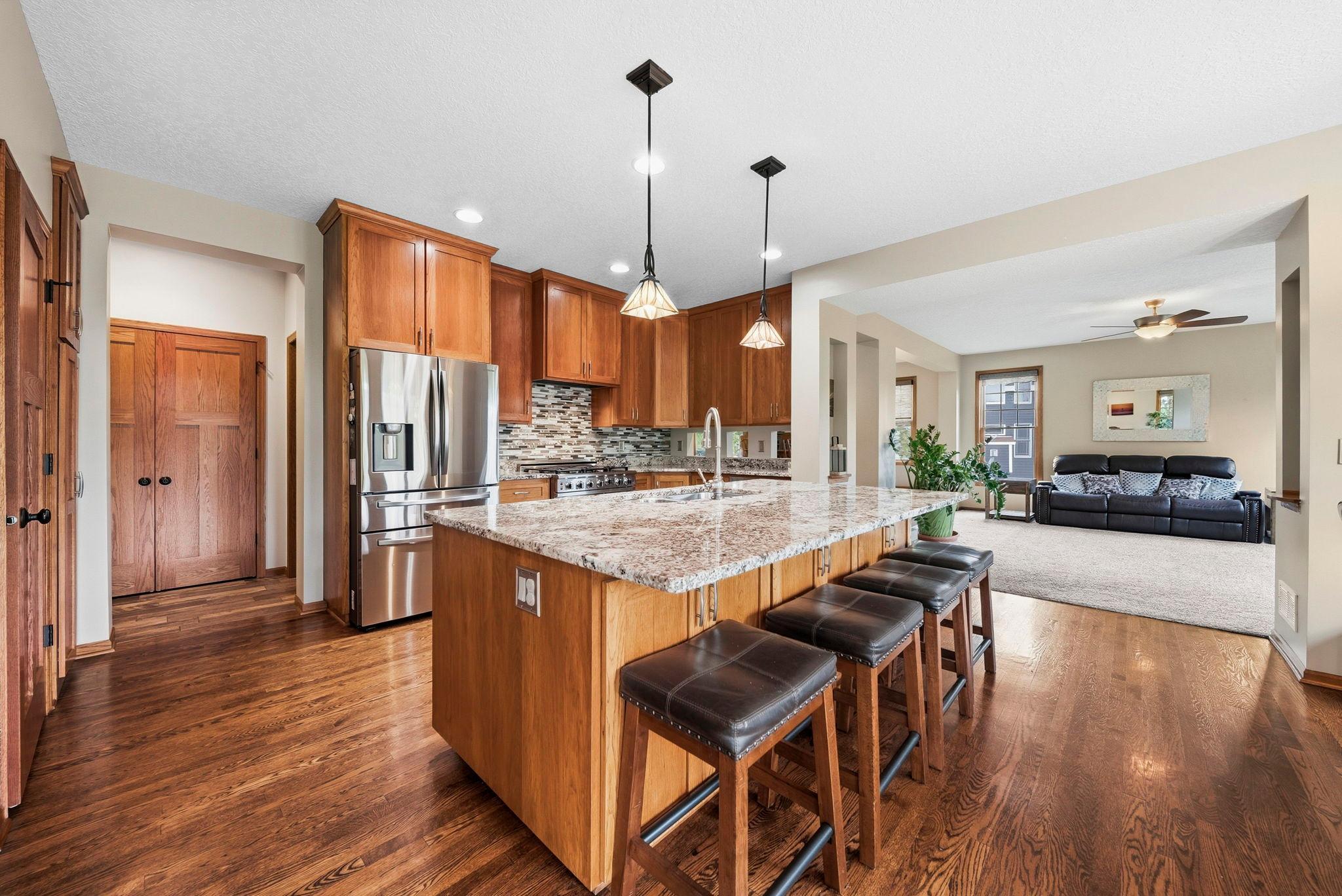 Massive, gleaming granite island with additional storage.