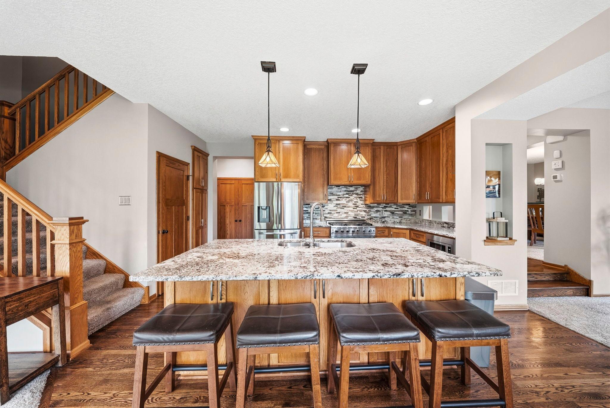 sprawling hardwood flooring throughout the kitchen
