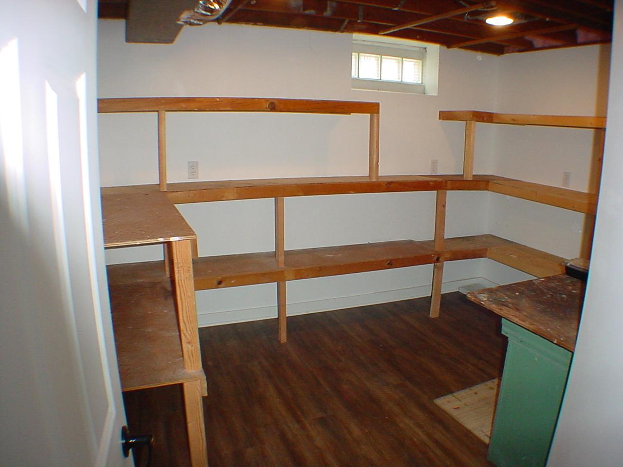 Craft, work room with plenty of natural light, space and built-in storage shelving. Light bright and open!