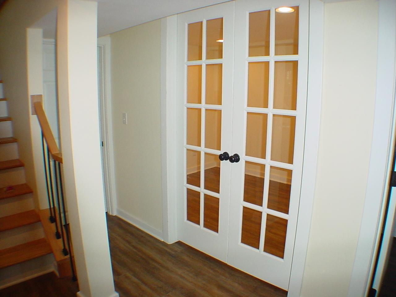 Lower level office hosting French doors.