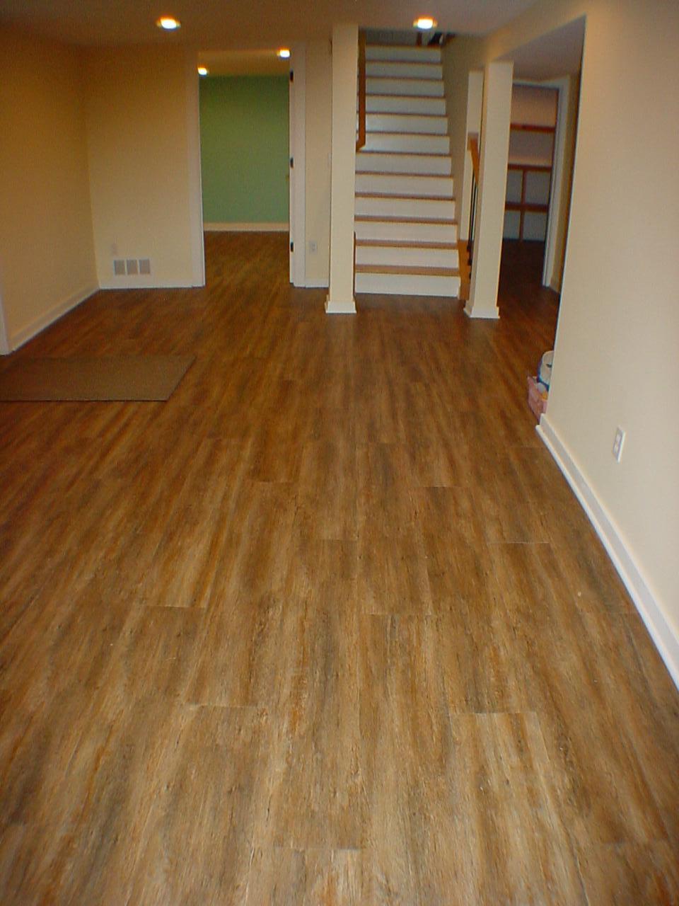 Luxury LTV flooring. Complements all the neutral decor. Durable for a walkout level. Warm and inviting.