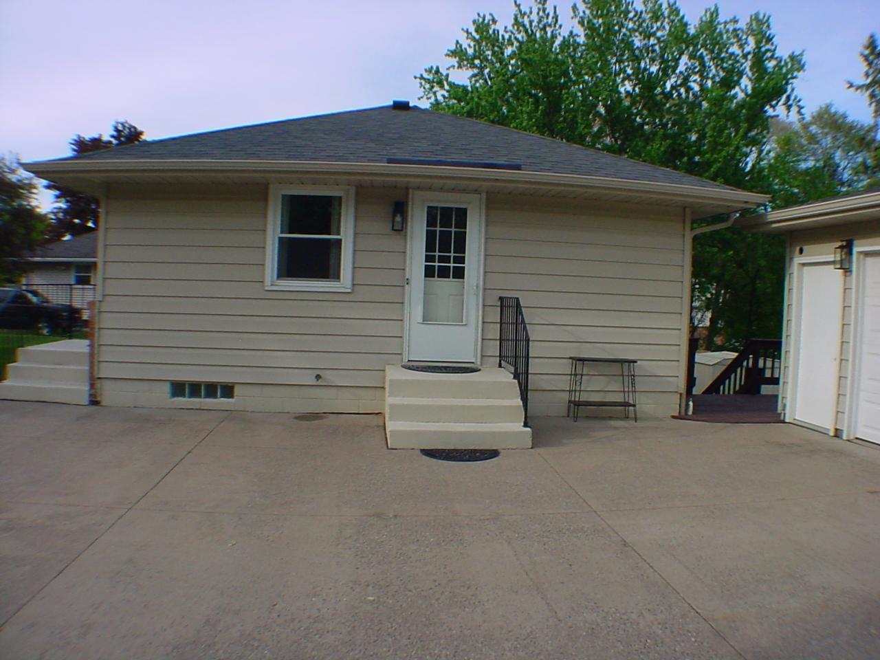 SW exposure between side entrance and garage. Home has all new exterior doors. Window were updated with the original owner. All these year only two families have owned this home!