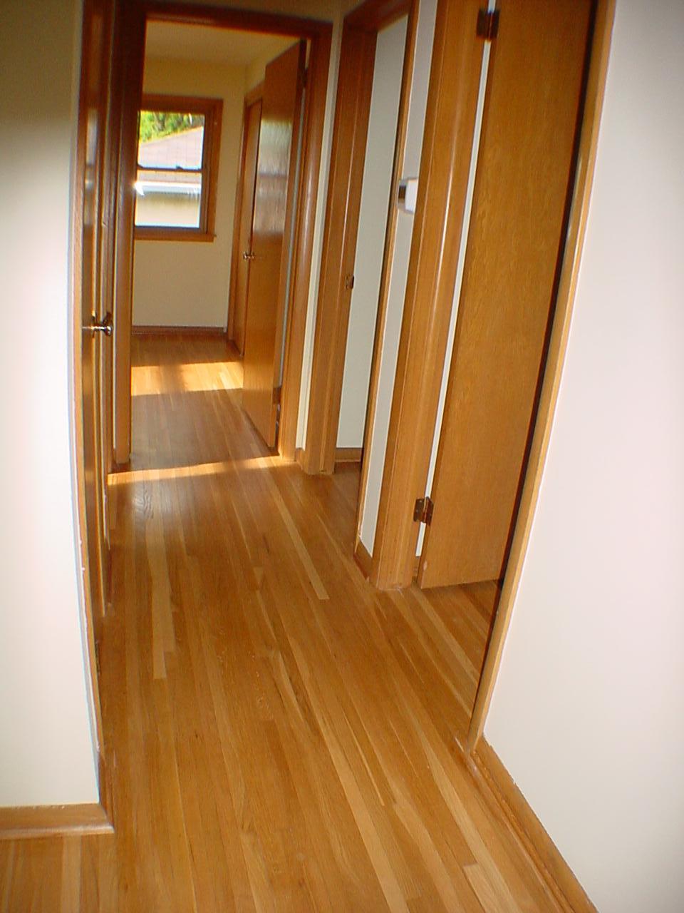 This hallway truly showcases the hard wood flooring.