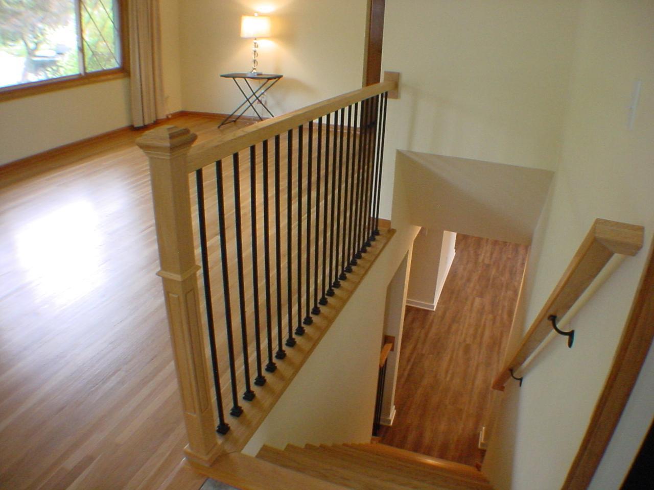 Beautiful open wood stair case to lower level, just off living room and dinette. A gate is included.
