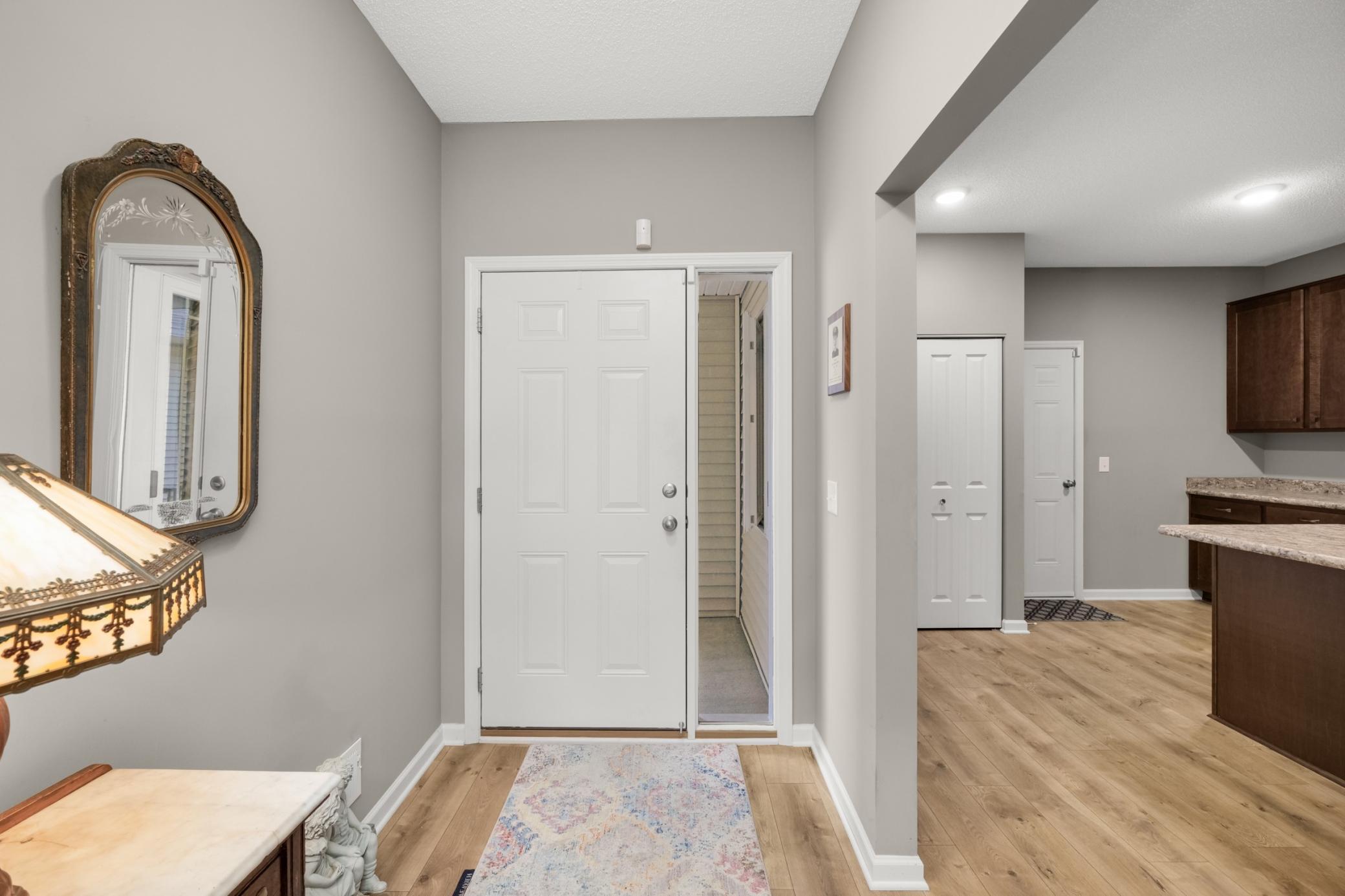 View of front door and foyer - kitchen to the right in photo