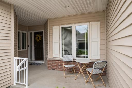 Lovely covered front patio and view of front door