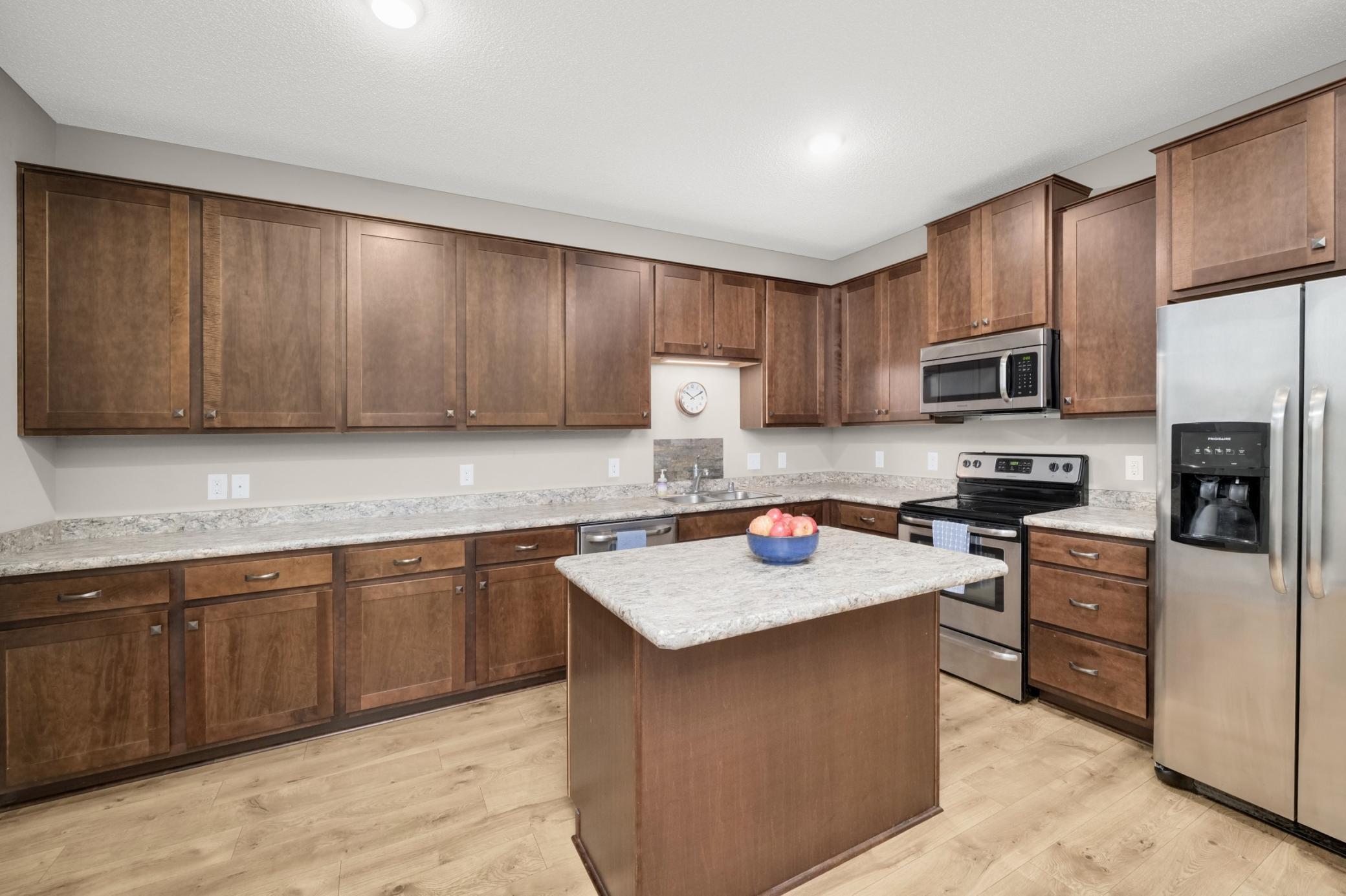 Note the ample counter and cupboard space in the kitchen
