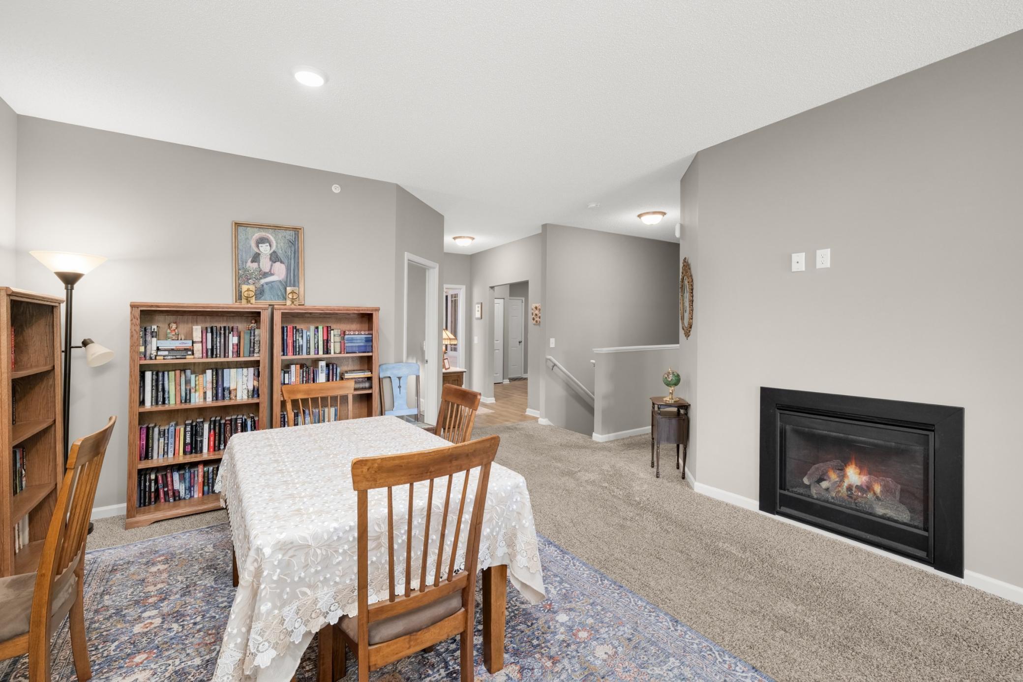 View from dining room toward center hallway and stairway leading to unfinished lower level