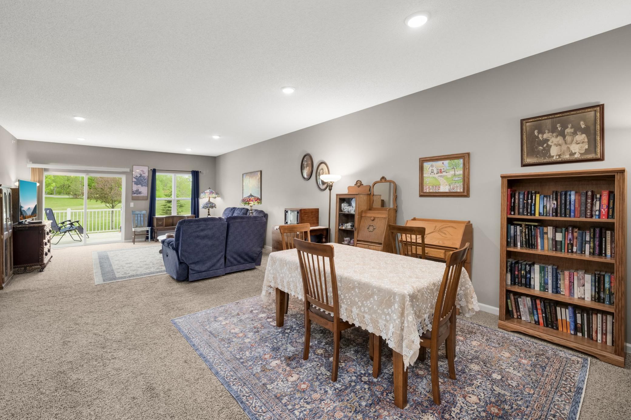 Dining area accomodates a large dining room table and hutchesnd