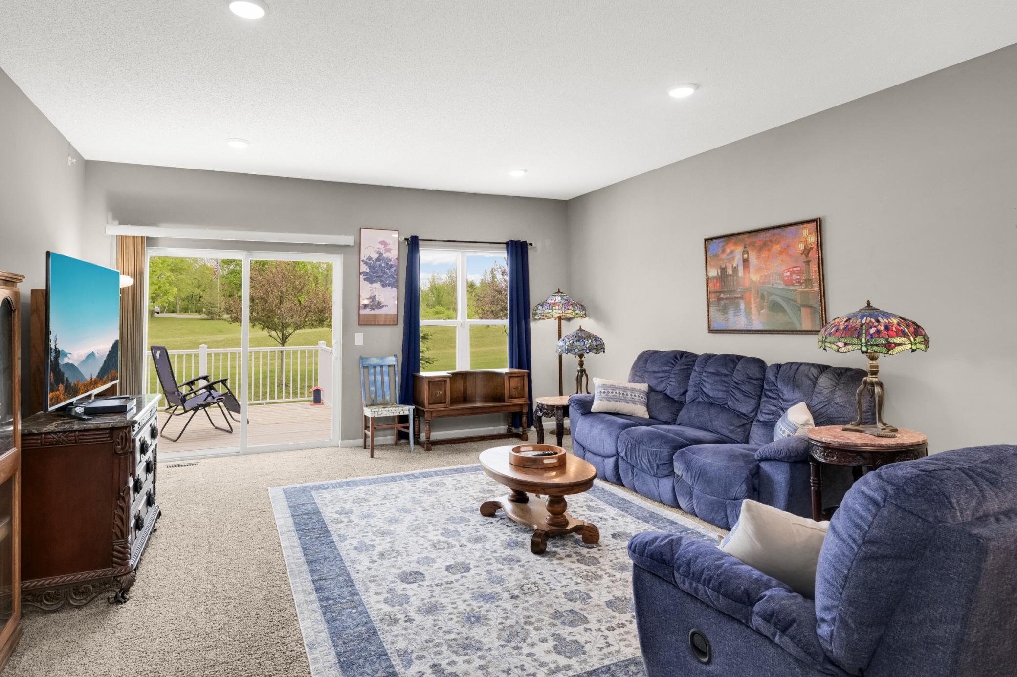 Large window and sliding glass door brings in great light to the living room and dining room