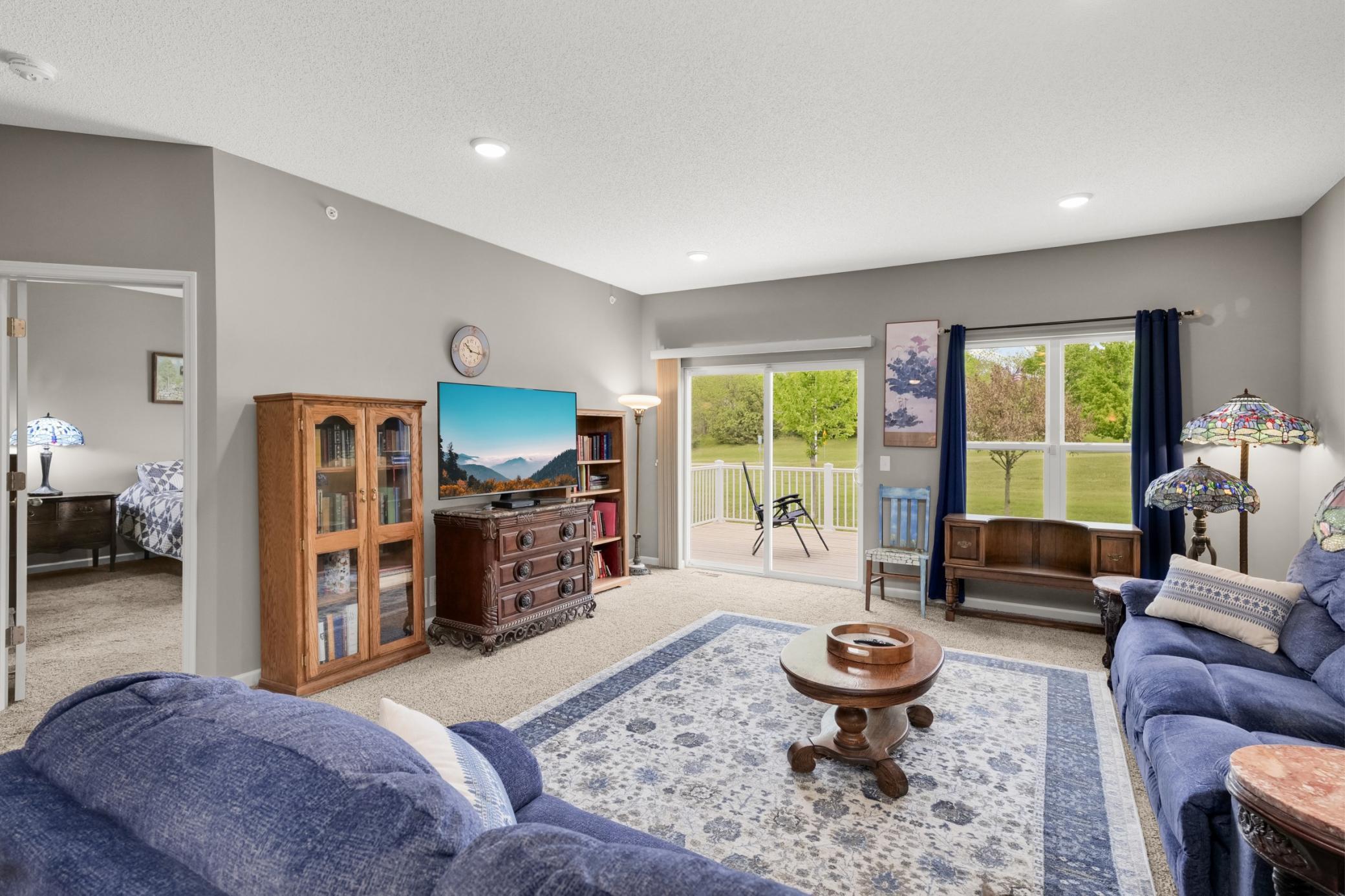 View of living room from dining room showing back deck