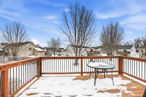 Deck overlooks the backyard and neighborhood!