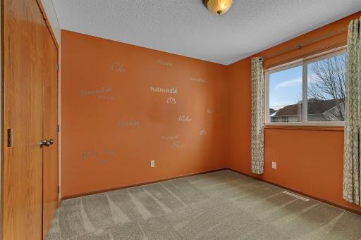 Third upper level bedroom with ample closet space.