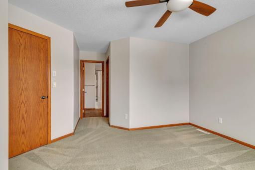 Primary bedroom connects to shared upper level bathroom.