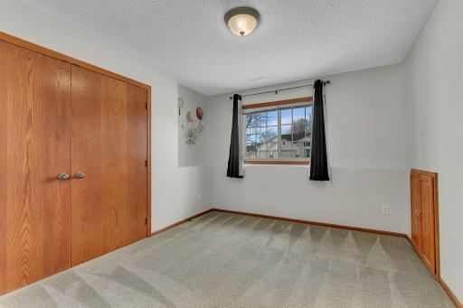 Lower level bedroom with crawl space access.