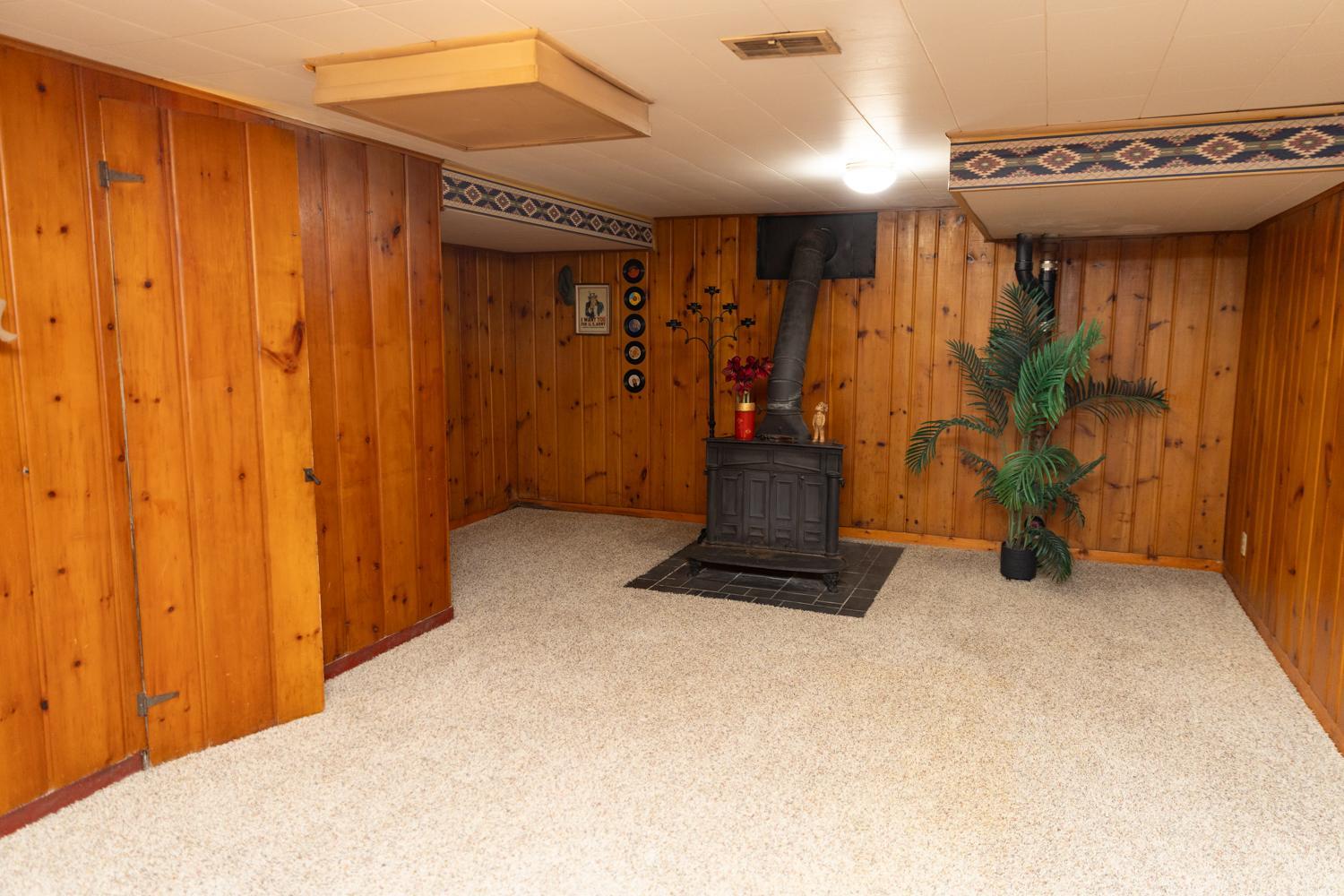 The other half of the Family Room featuring wood-burning stove