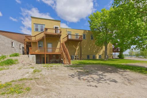 South side includes entrances to both apt and 3rd commercial space