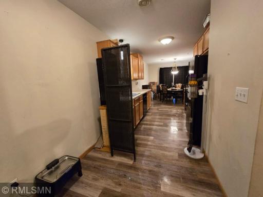 Galley kitchen area as seen walking in from garage