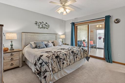 Bedroom 1 with a walk-in closet, sliding door to the porch & bath.