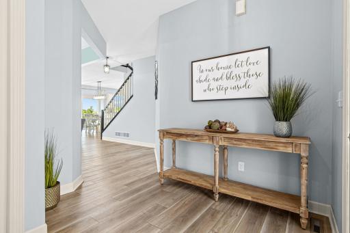 Walk into your large entry way with front hall closet and beautiful LVP floors!