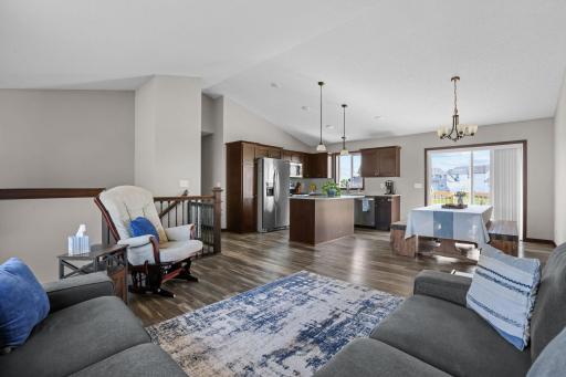 Desirable open floor features vaulted ceilings and attractive, low maintenance flooring