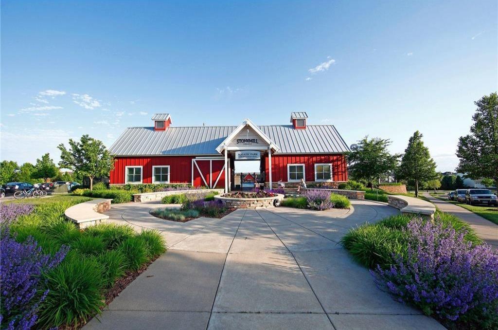 This aquatic center truly feels like a resort, featuring a heated in-ground Olympic-size pool, kiddie pool, locker rooms, and inviting picnic areas, with views overlooking the whole neighborhood. Located at 11500 Halstead Trail, Woodbury, MN 55129