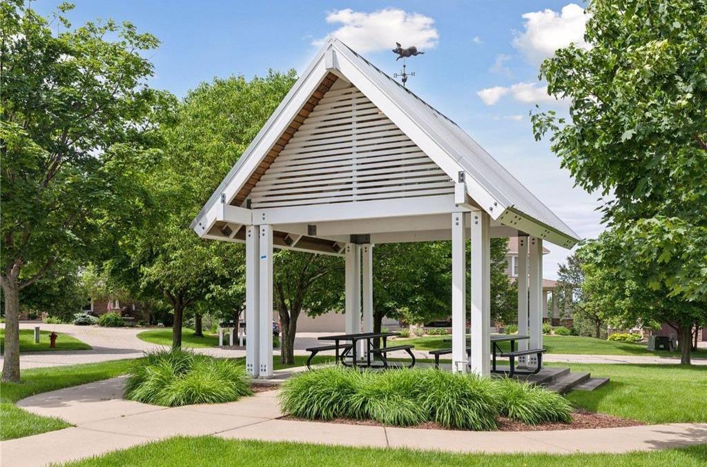This charming gazebo is one of several thoughtfully placed throughout Stonemill Farms, creating perfect little meet-up spots. proof the architect considered every detail.