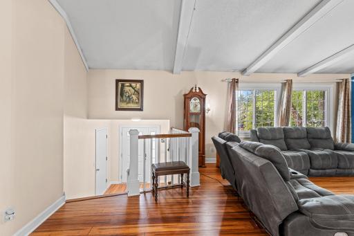 Wood beams and natural light welcome you to the upper level and invite you to spend family time together