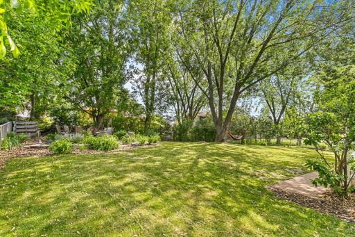 Your large back yard comes complete with beautiful perennials, a composting station and a fire pit