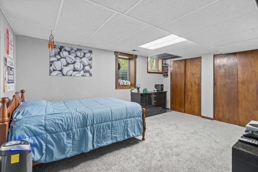 Lower-level bedroom (bedroom #5 overall) also with new carpet and dual closets