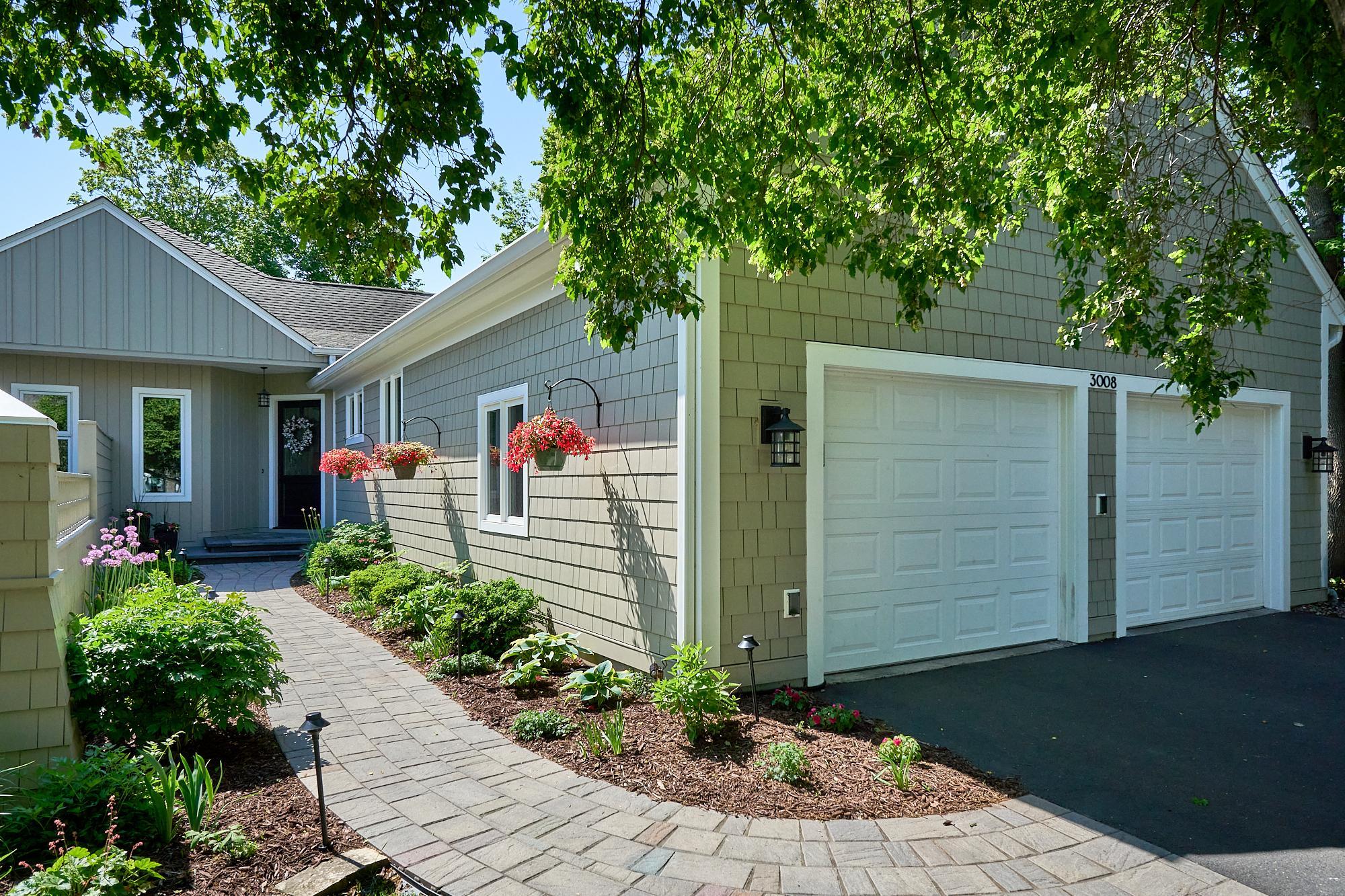 Newly designed landscaping adds to this home's understated elegance. Hardie Board shingle-style siding and trim, an underground sprinkler system, and rainwater management systems make this a delightful place to come home to and relax in.