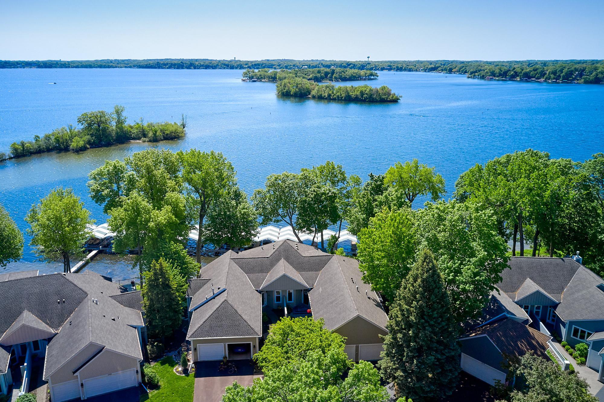 Extraordinary Pelican Point end-unit townhome. Sweeping southerly views of Lake Minnetonka’s Spring Park Bay, a quieter & more refined bay protected by Phelps Island.