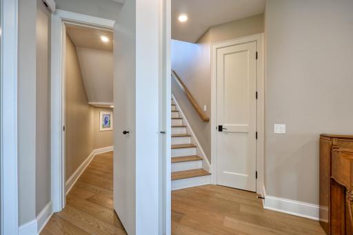 Bookcase 'secret door' at the bottom of the steps opens to reveal a delightful children's toy room tucked under the steps