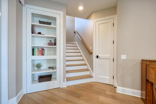 Bookcase 'secret door' at the bottom of the steps opens to reveal a delightful children's toy room -