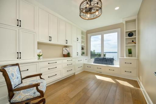 Bedroom 3 is on the walkout-level with stunning Lake Views. Custom-built-in cabinetry and a window seat. This bedroom could double as a craft room or nursery.