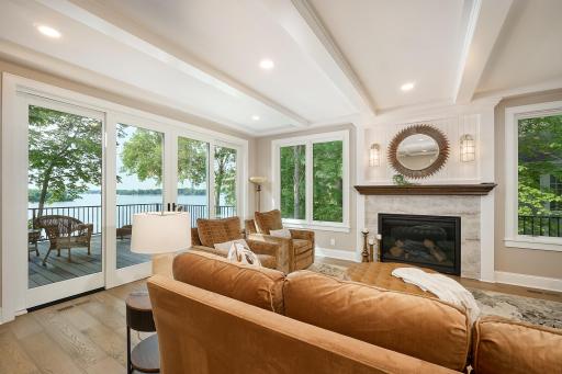 Breath-taking lake views through the new four-panel sliding patio doors as you relax in the living room by the gas fireplace.