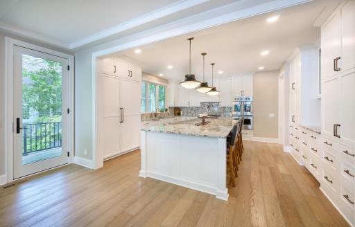 West side door leads from the gourmet kitchen to a second deck.