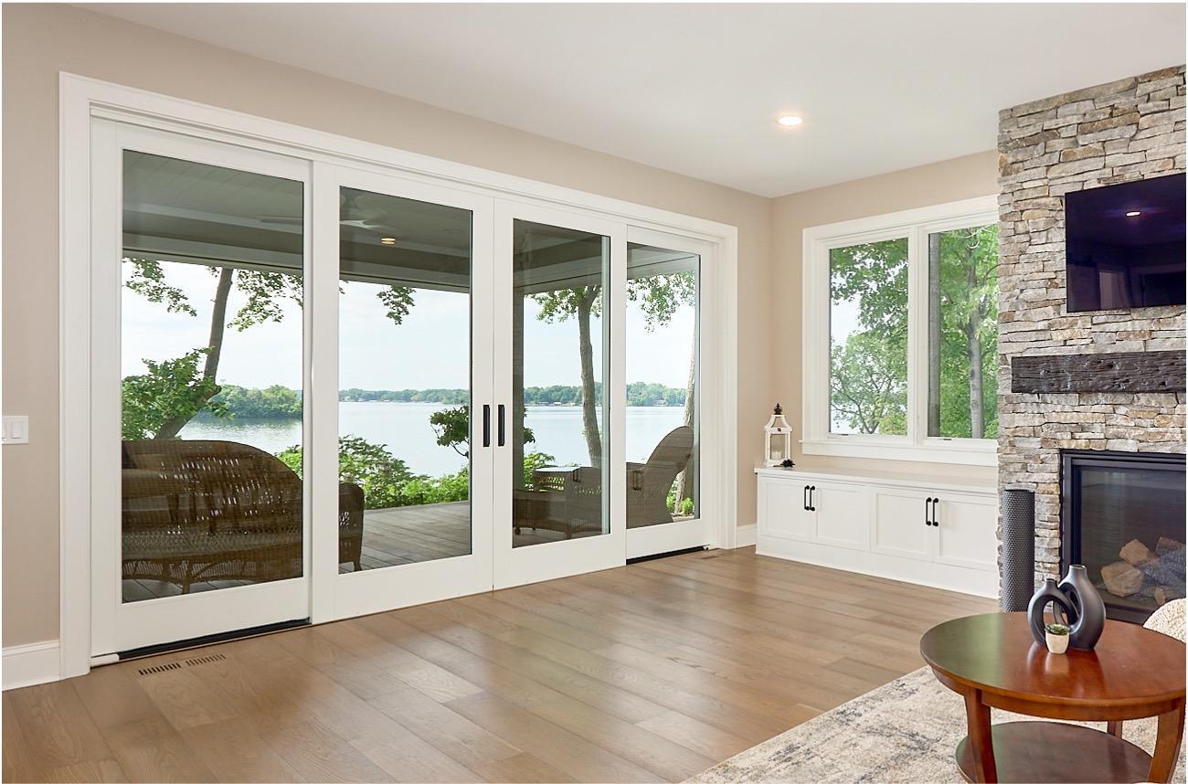 New dual four-panel sliding patio doors open to sweeping southerly views of Lake Minnetonka’s Spring Park Bay, a serene and refined waterfront setting protected by Phelps Island with ever-changing seasonal beauty.