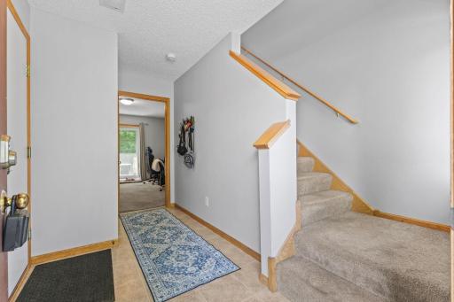 Stepping into the entryway, youâre greeted by a balanced blend of function and style. The built-in closet sits discreetly along the wall, offering organized storage for coats, shoes, and seasonal items.