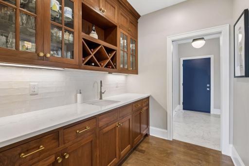 Butler pantry connecting the mud room to the kitchen