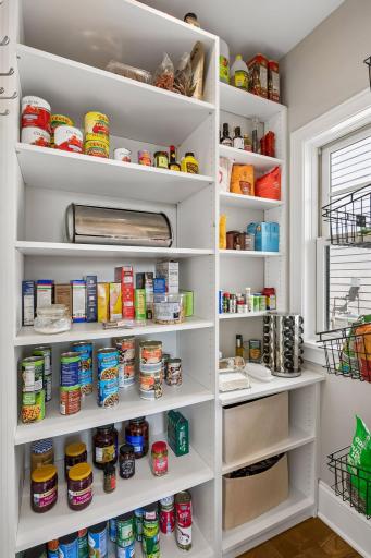 Pantry off the kitchen with tons of storage for food staples