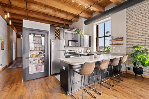 Seller's thoughtfully switched the w/d to the other side of the half wall to create a pantry
