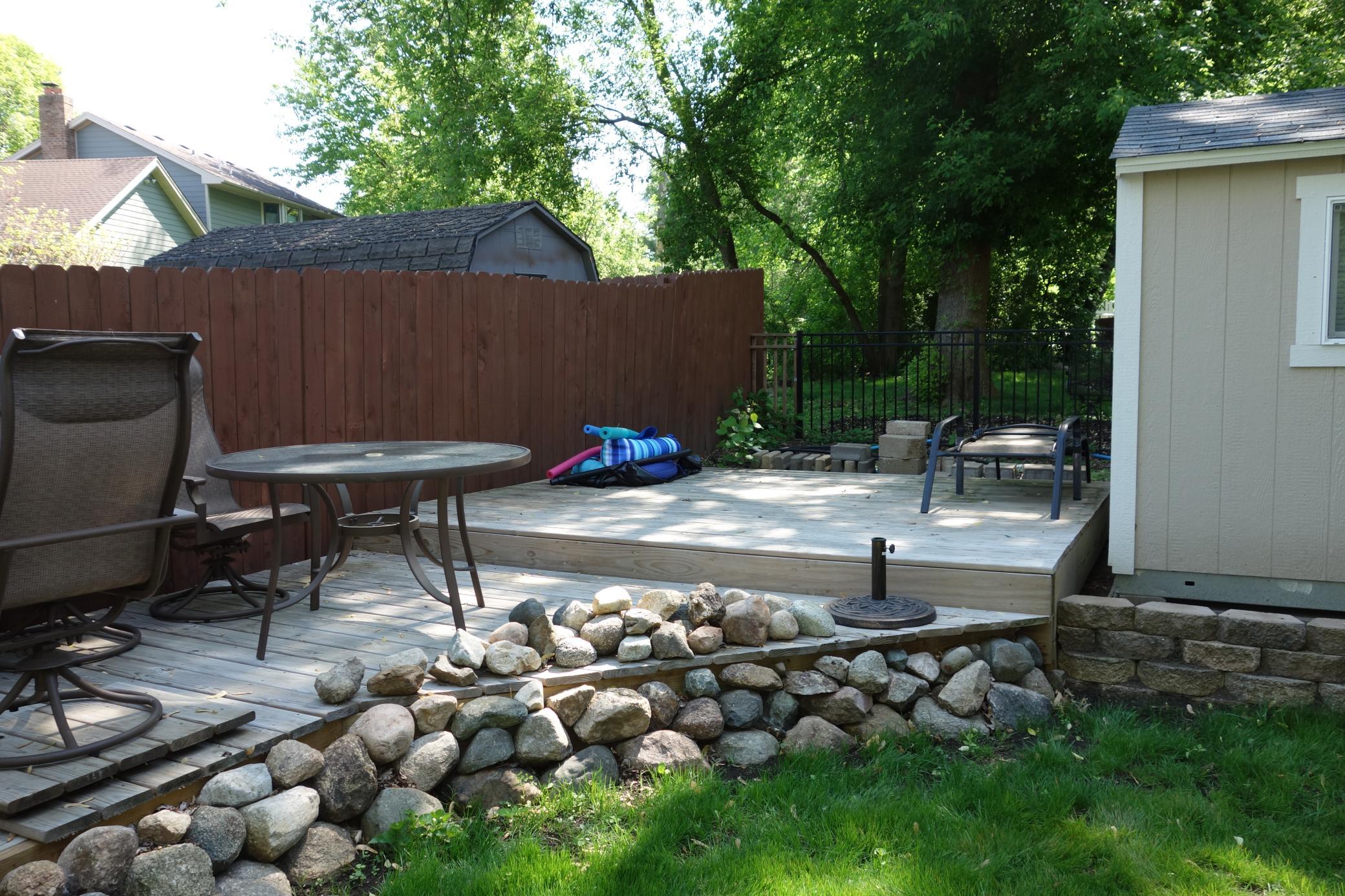 Play/entertainment deck to rear of shed.