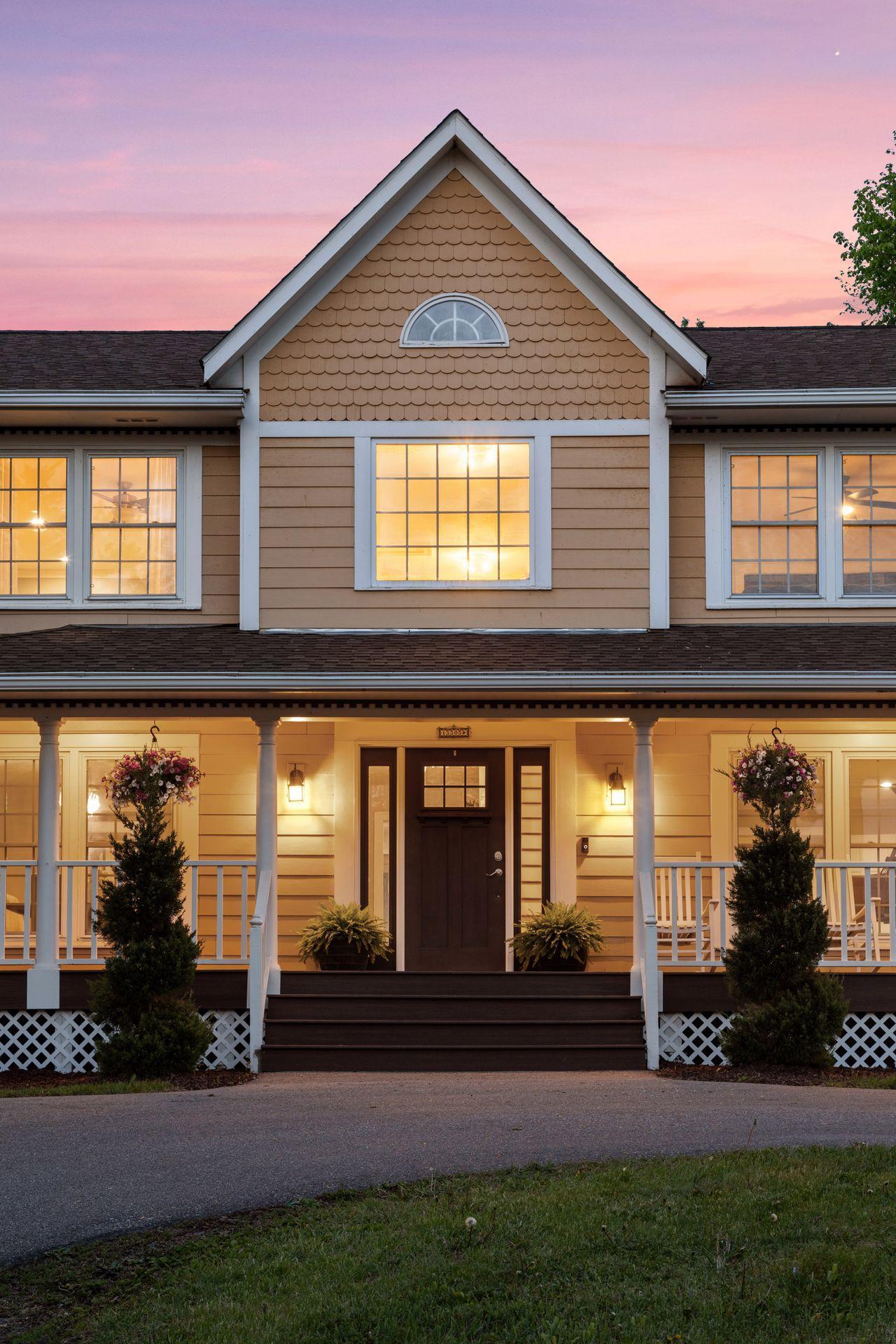 The home has a classic exterior with Hardie plank siding and a porch with composite flooring.